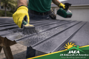leaning metal shavings off a metal roofing panel surface to prevent rust stains after cutting.