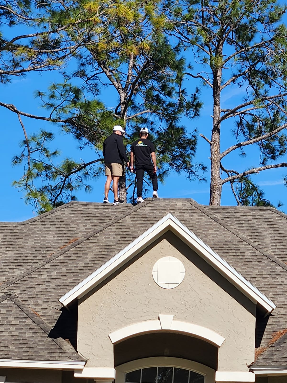 2 roofers doing a roofing inspection in Port St. Lucie