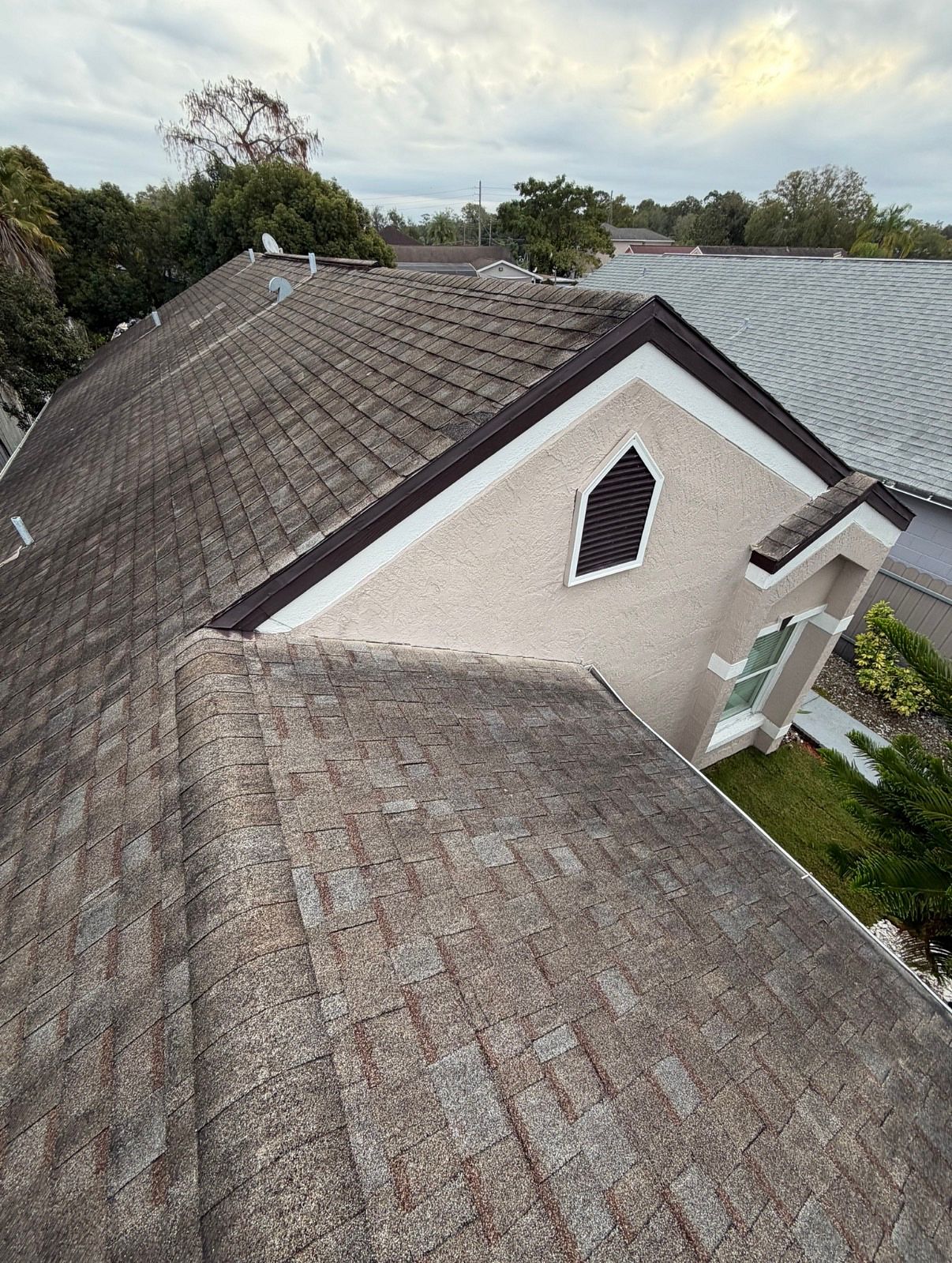 Before: damaged roof on Orlando home before replacement by JA Edwards