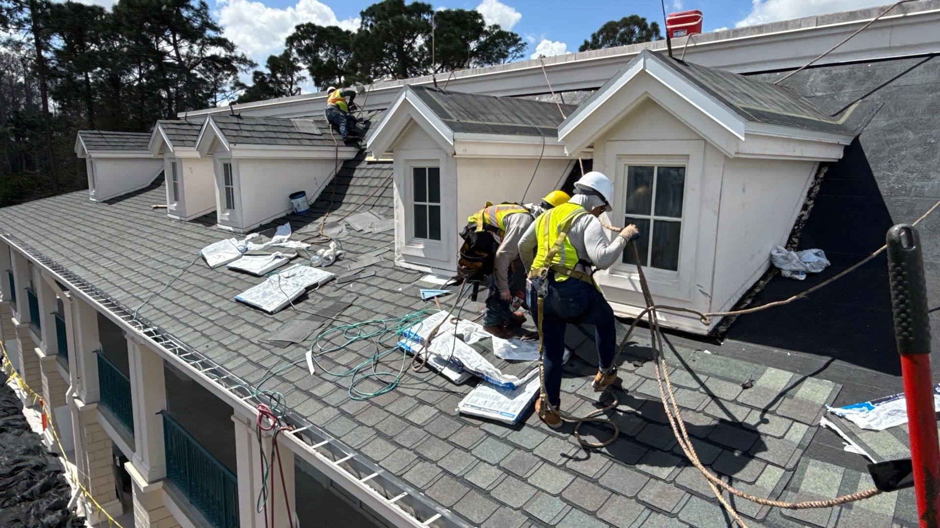 JA Edwards roofing crew installing a shingle roof on a home in Orlando, FL